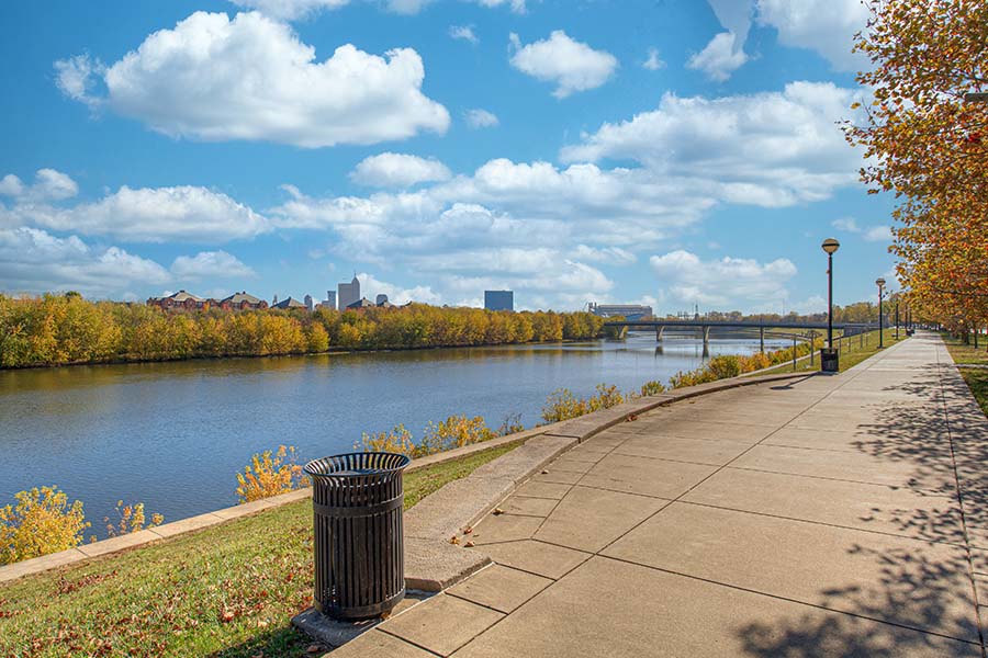 Keep your pets safely leashed when enjoying the grounds and views of your community like these at Riverview Apartments. View of a river during the fall season the from Riverview Apartments