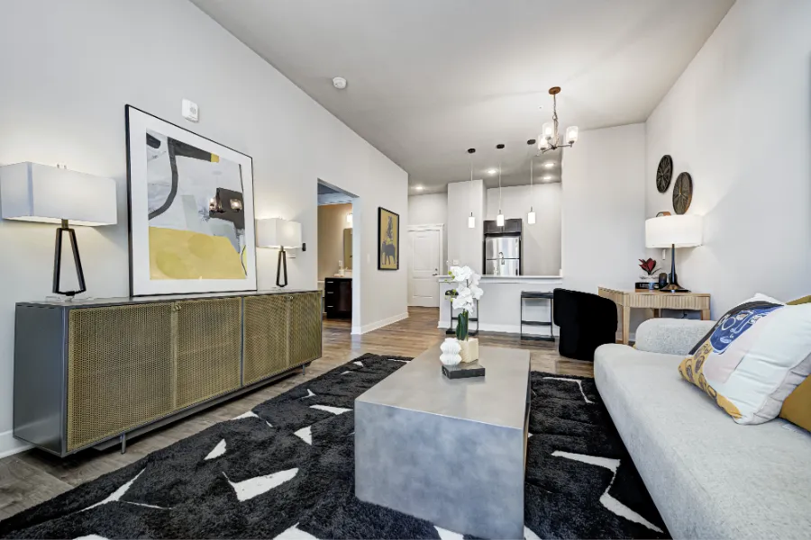 A spacious apartment floor plan like this one at Continuum Apartments ensures your favorite furniture fits. Modern furniture in a spacious apartment living room
