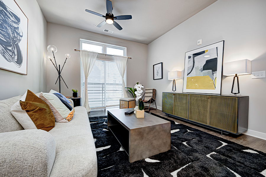 Versatile pieces with built-in storage like the coffee table, TV stand, and end tables seen here make sense for apartment living.