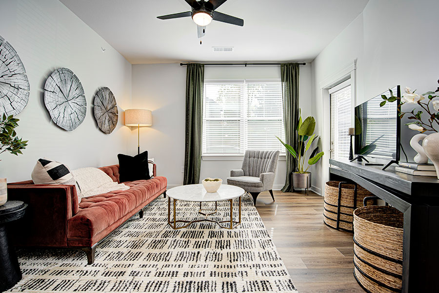 You want your living room, like this one at East Bank Apartments, to be comfortable, but you can still reduce the use of HVAC equipment. Modern style living room at East Bank