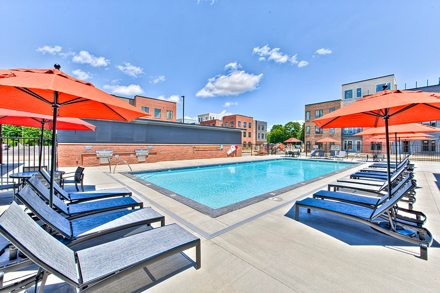 Community amenities like this beautiful pool at The Edge Apartments on Indy's North Side will help you decide where to live. Swimming pool with lounge chairs at The Edge Apartments on Indy's North Side.