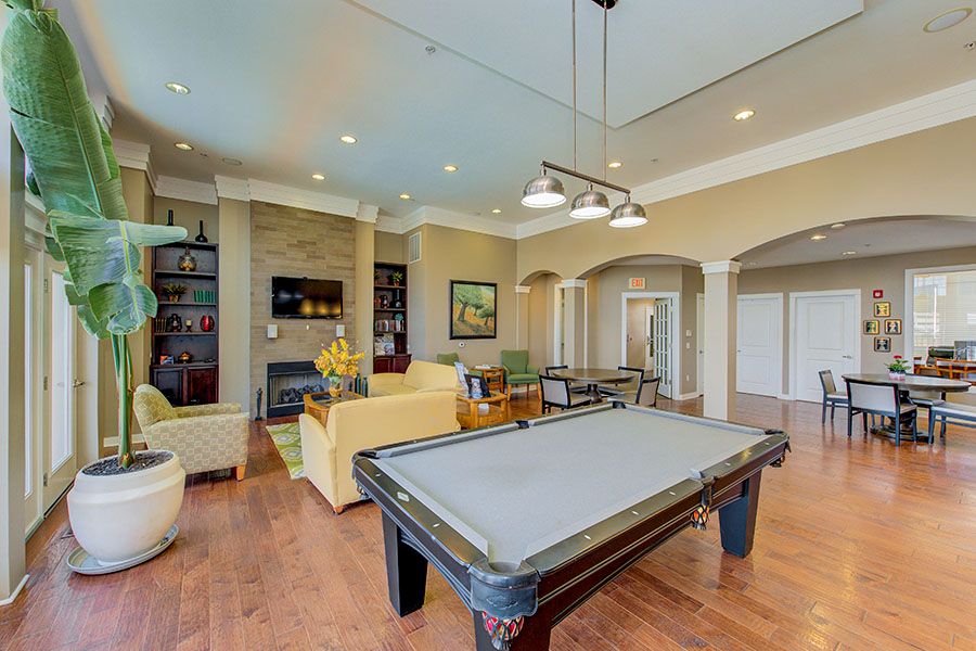 If your Plainfield apartment has a clubhouse like this one at Waverley Apartments, ask about renting it for your parties. A high-ceilinged rec room with pool table at Waverley Apartments.