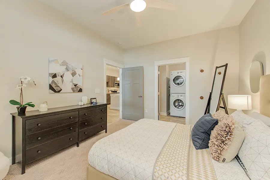An apartment bedroom view showing two doorways